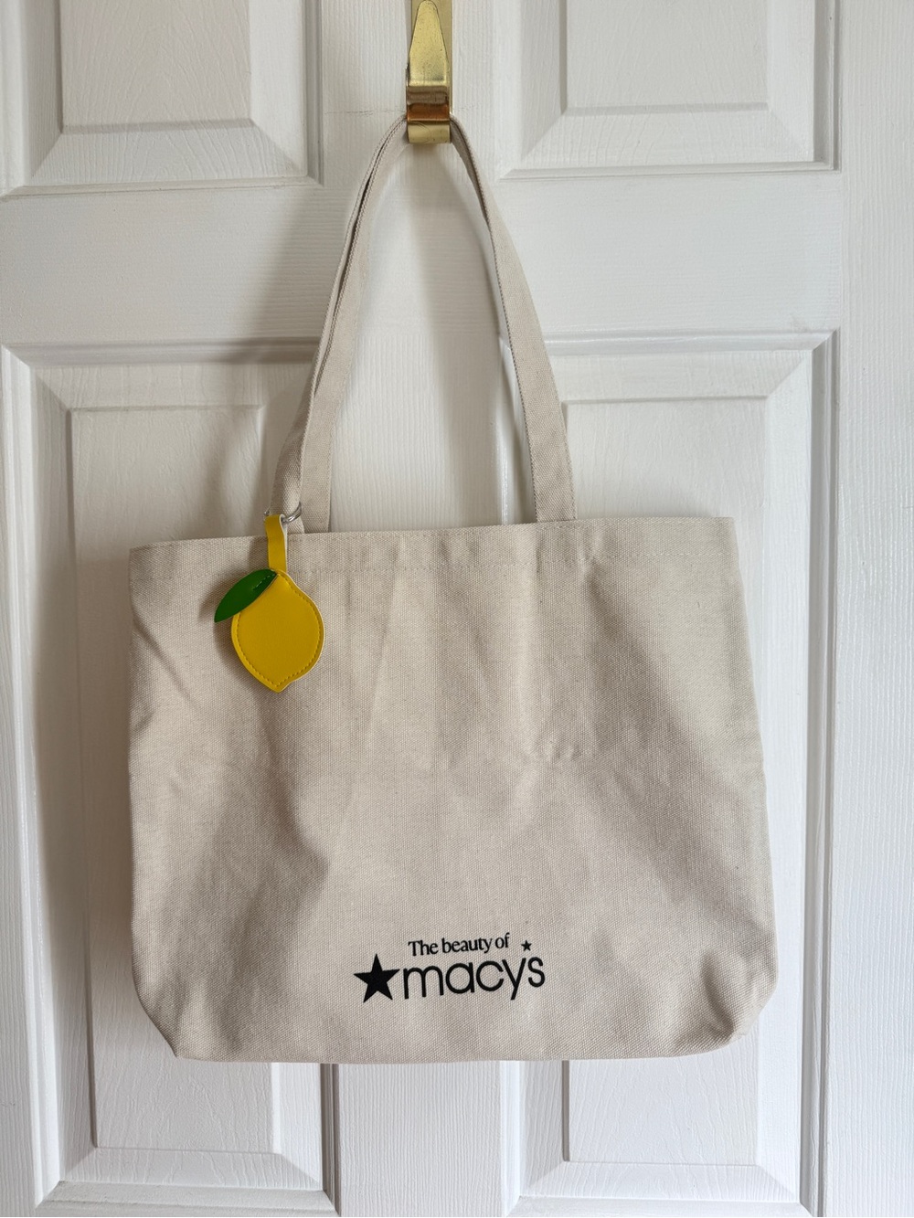 Macy's tote bag with lemon charm
